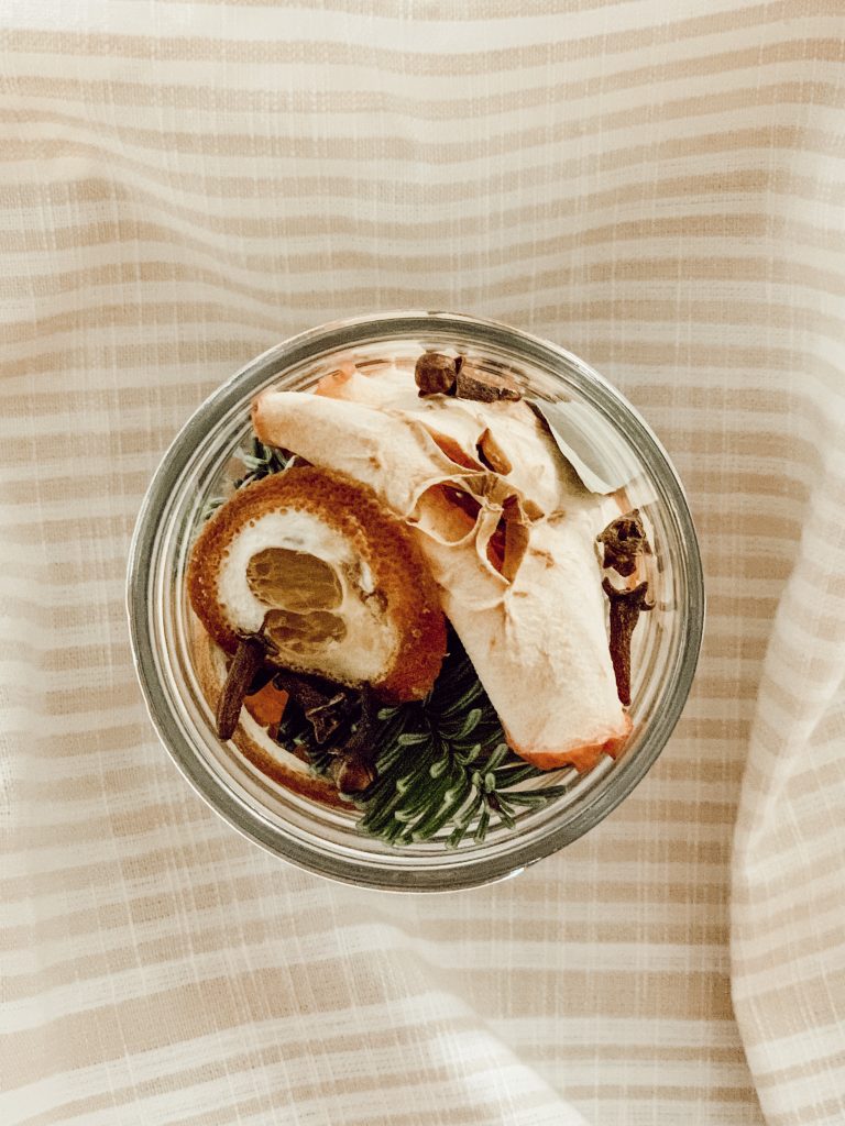 Add simmer pot ingredients to a glass mason jar for Christmas gift giving.