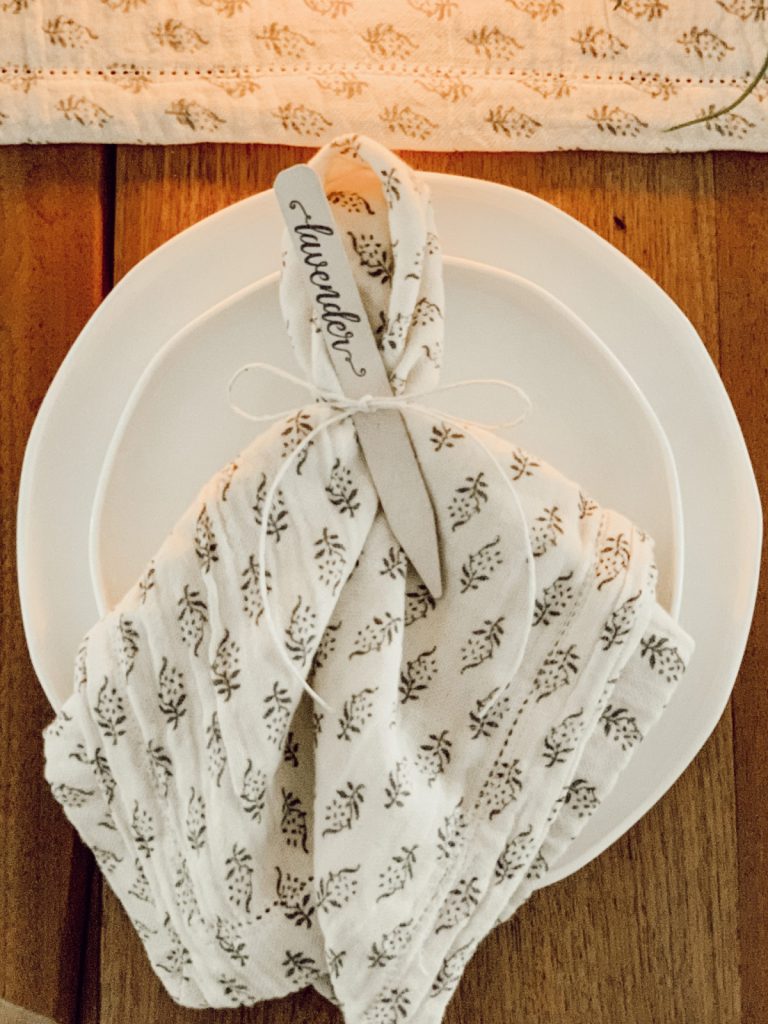 Mother's Day table decorations include linen napkins & herb makers.