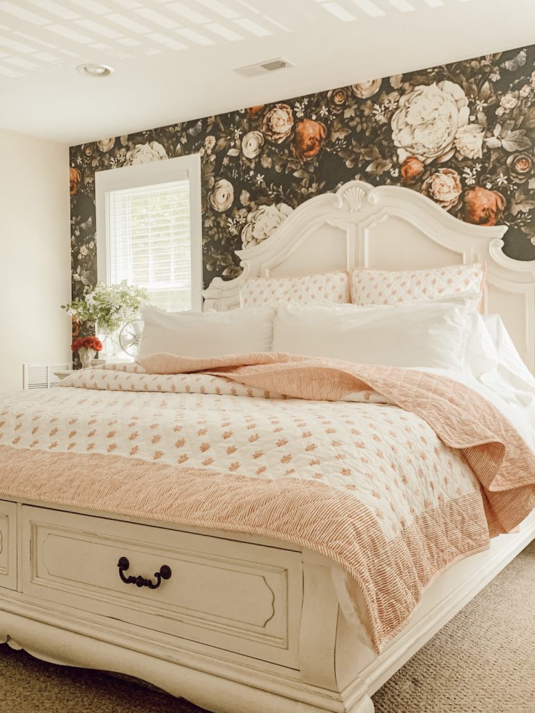 Floral wallpaper & country farmhouse bed for summer.