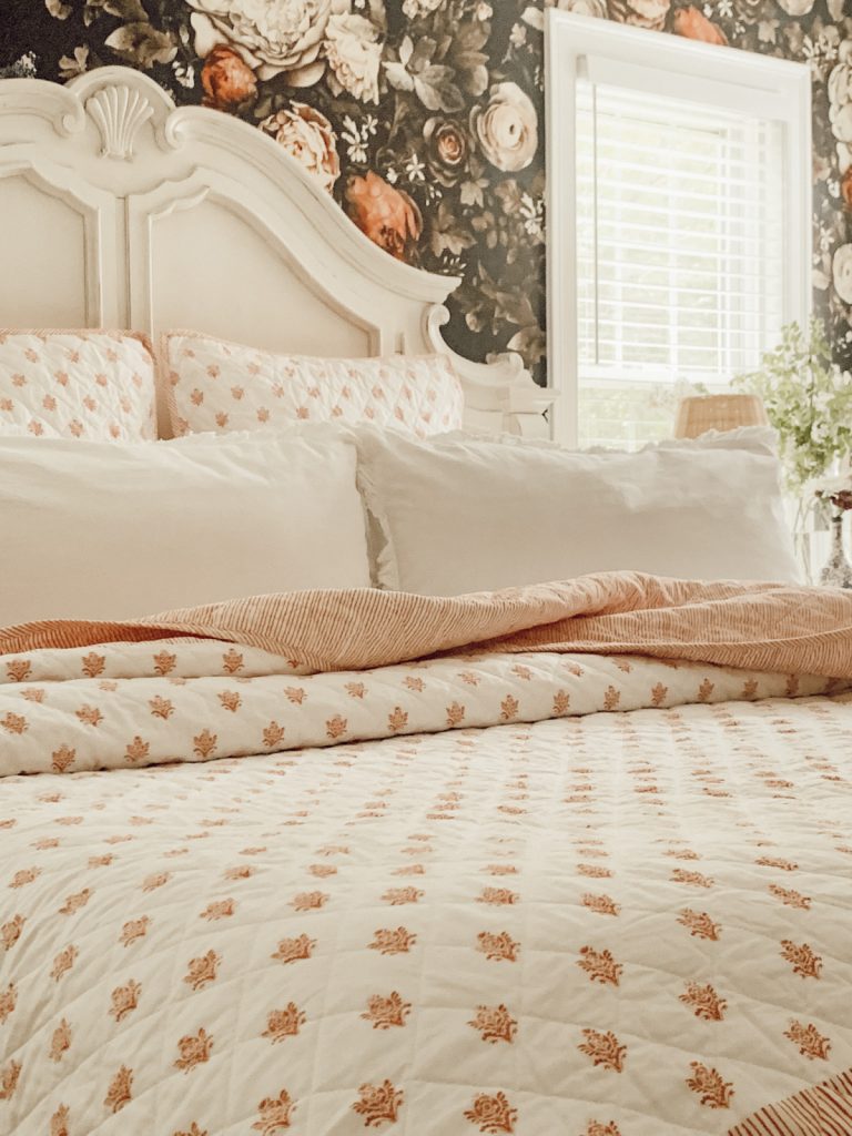 Lightweight summer bedding in a farmhouse cottage bedroom.