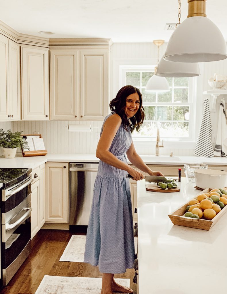 Preparing ingredients for simmer pot with fresh fruits and herbs.