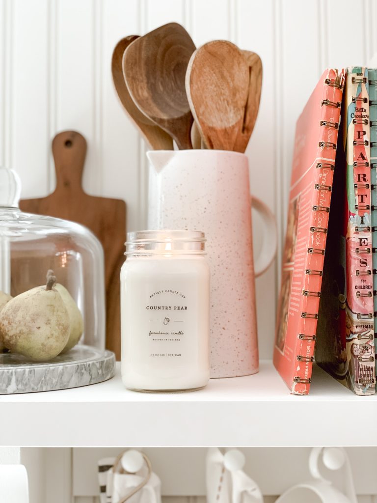 Cottage farmhouse decor in the kitchen with a candle.