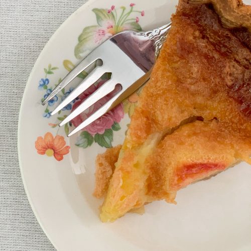 Grandma's peach pie with custard filling for a delicious summer dessert.