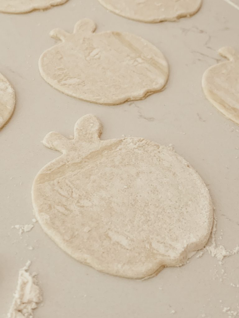 Puff pastry cut out into apple shapes for an easy apple pie recipe.
