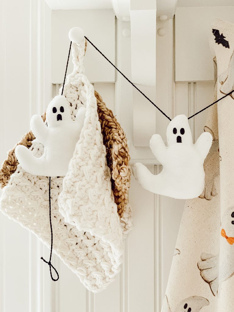 Easy DIY Halloween garland with twine and fabric stuffed ghosts.