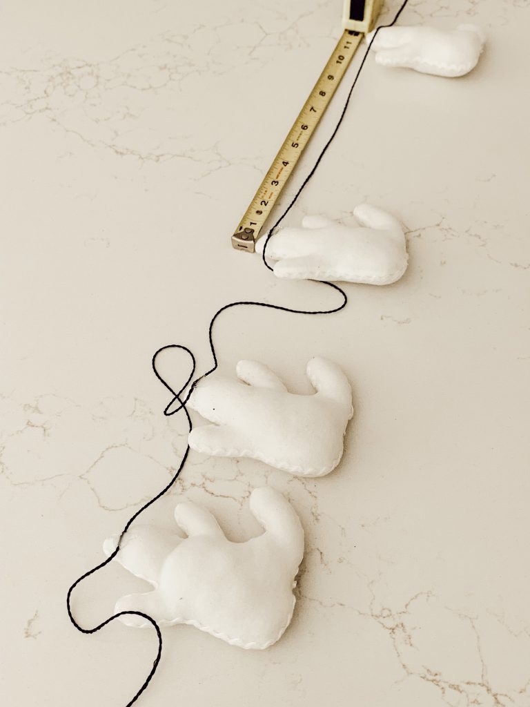 DIY Ghost garland for spooky and cute Halloween decorations.