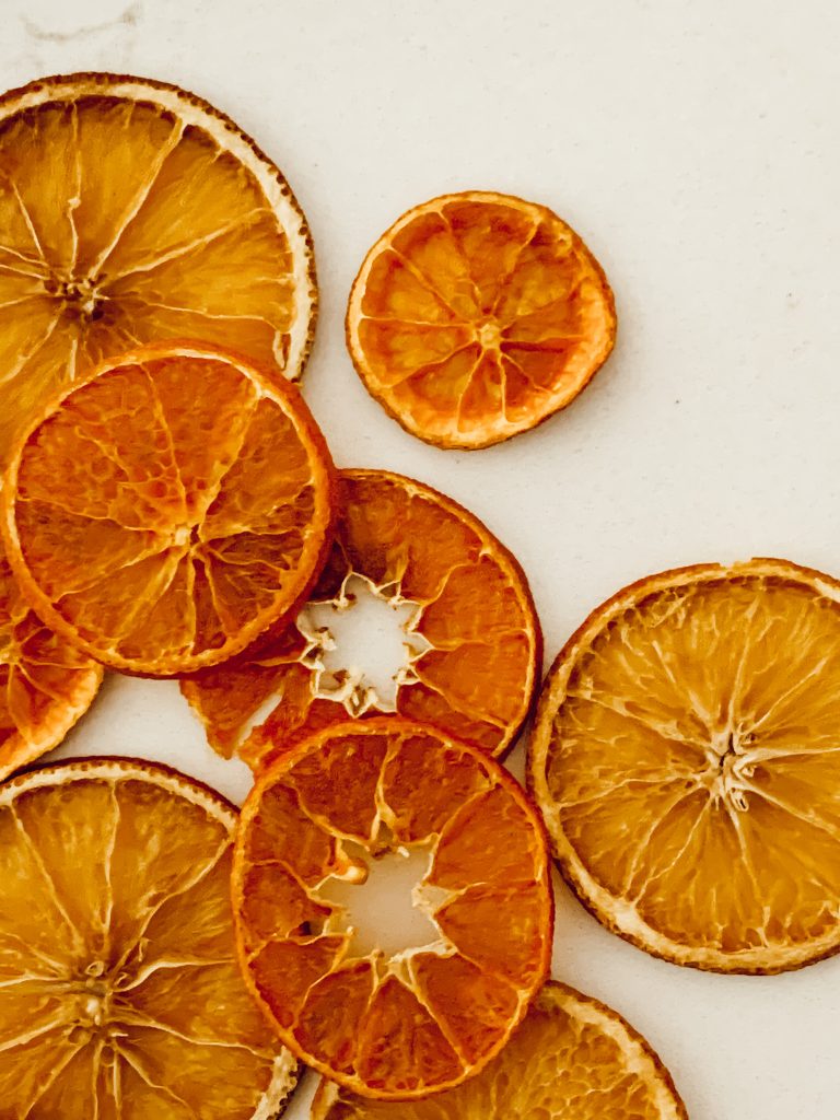 Dehydrated navel orange slices in the oven for holiday decor.