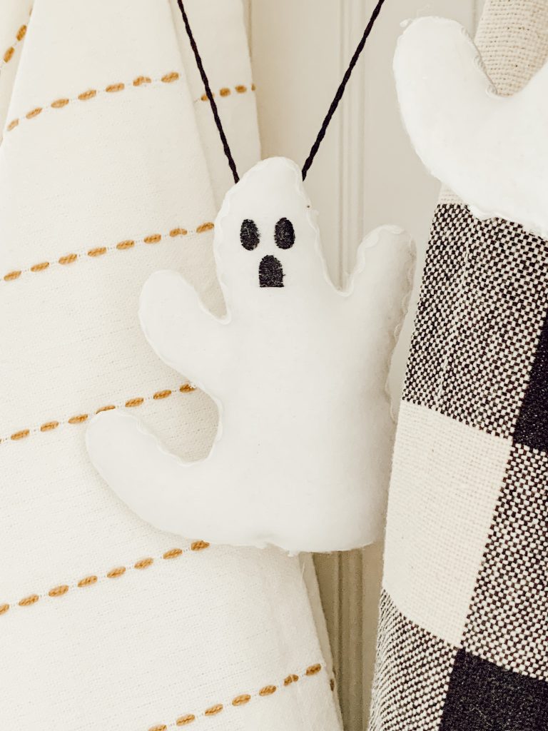 Easy Halloween craft with stuffed ghosts and black twine.
