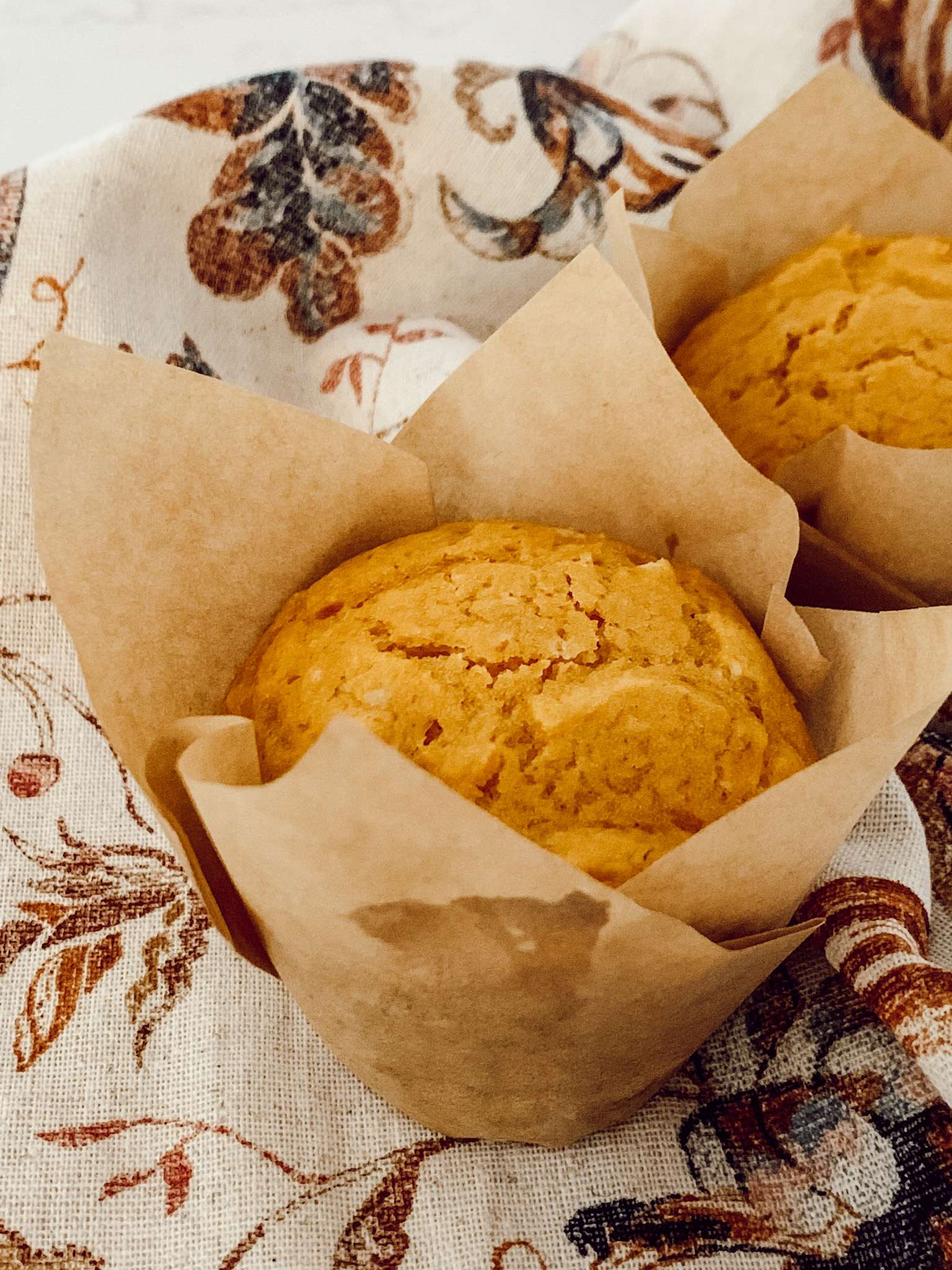 Pumpkin cake mix muffins made with pumpkin puree and yellow cake mix.