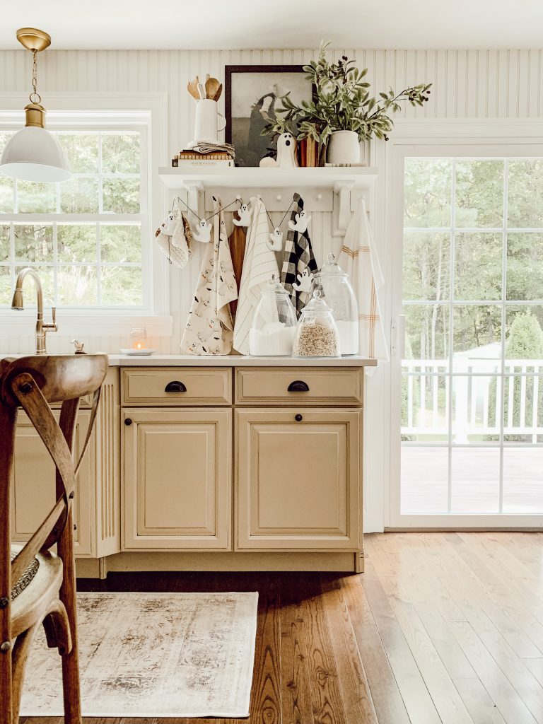 Spooky ghost garland hanging in the kitchen for festive holiday decor.