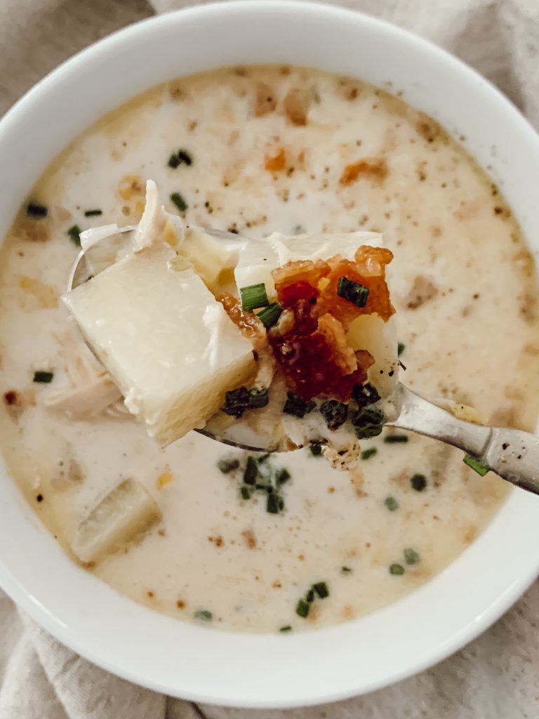 Creamy chicken corn soup is filled with yellow waxed potatoes, corn kernels, and shredded chicken.