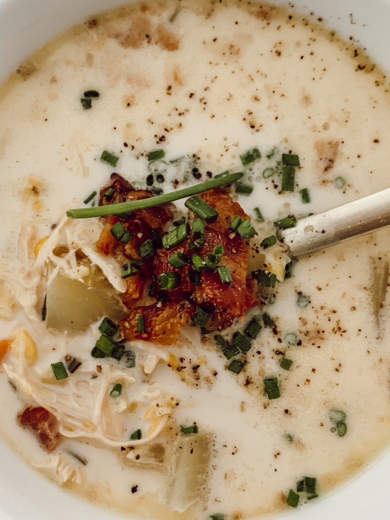 Easy crockpot chicken soup recipe with shredded chicken and fresh ingredients.