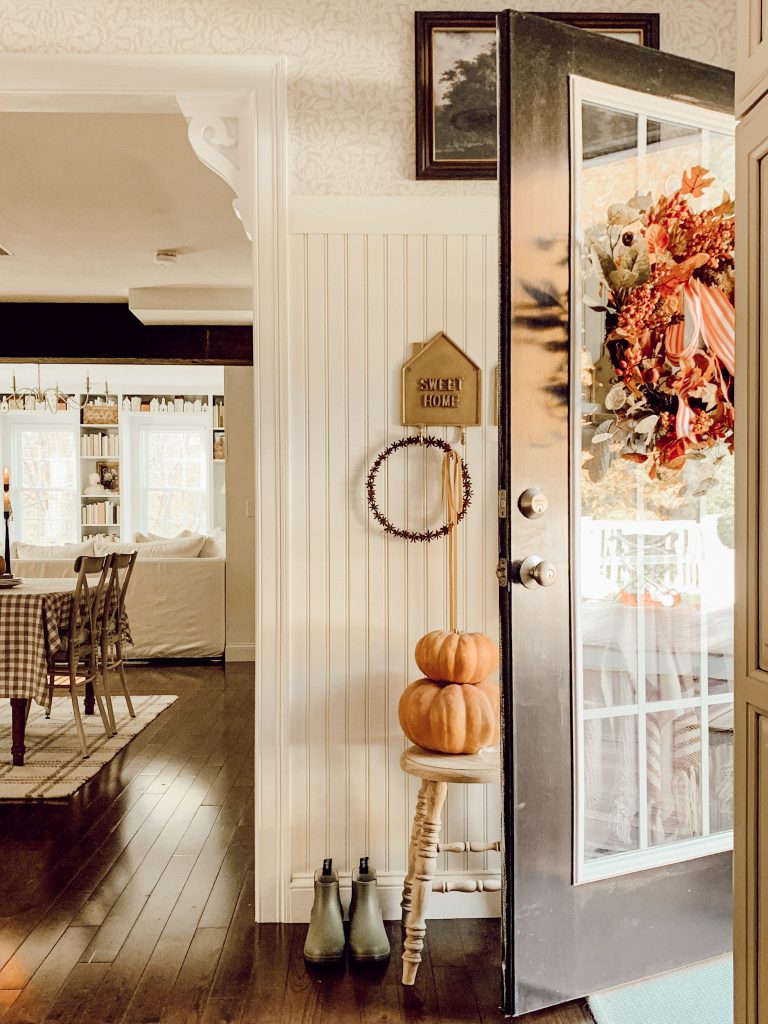 Hang seasonal decorations like a wreath on your front door.