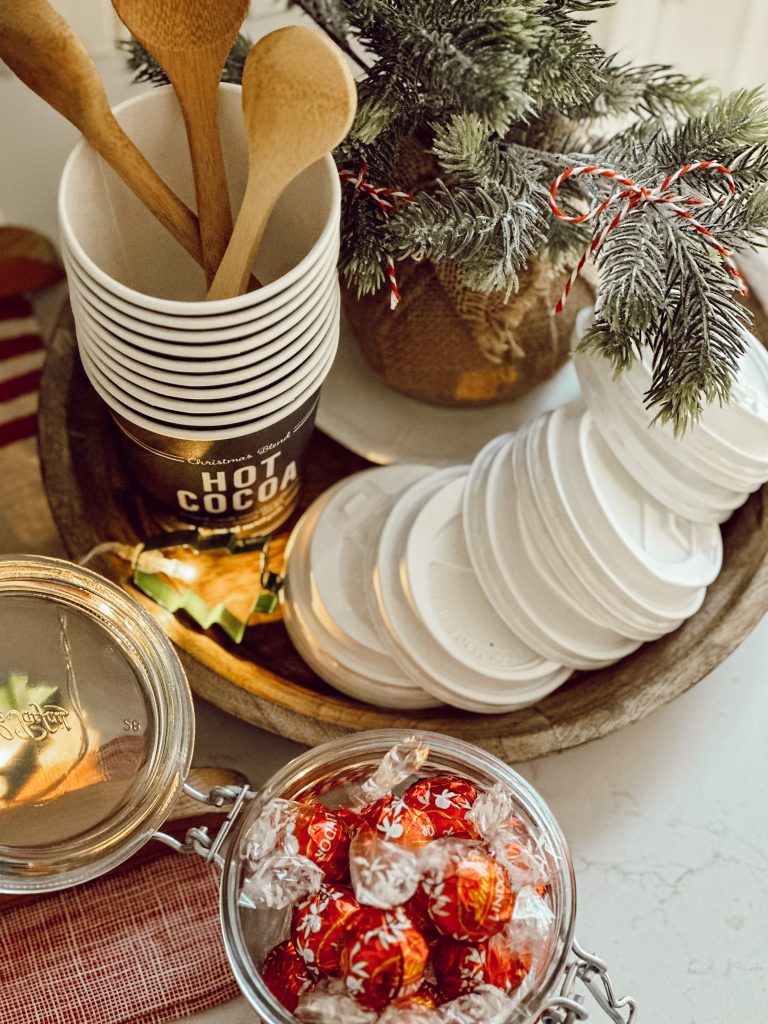 Christmas party idea for the holidays with a drink station and sweet treats.