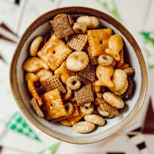 Football season party food with cheese crackers, goldfish, and Chex cereal.