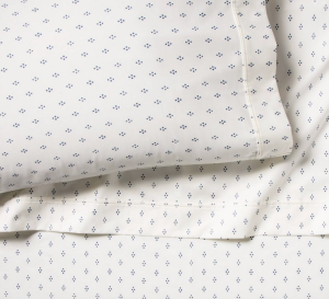 Blue dot cotton sheets are cozy spring bedding.