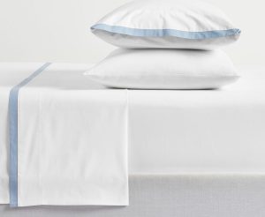 Blue & white cotton sheets for a cozy cottage bedroom.