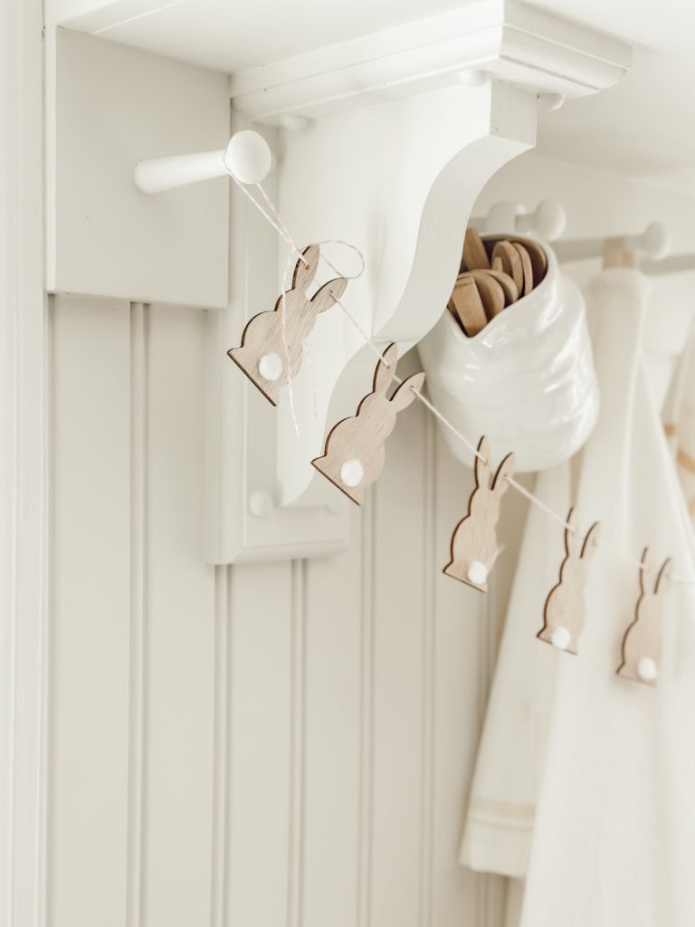 Easter rabbit garland DIY with wooden rabbits and twine.