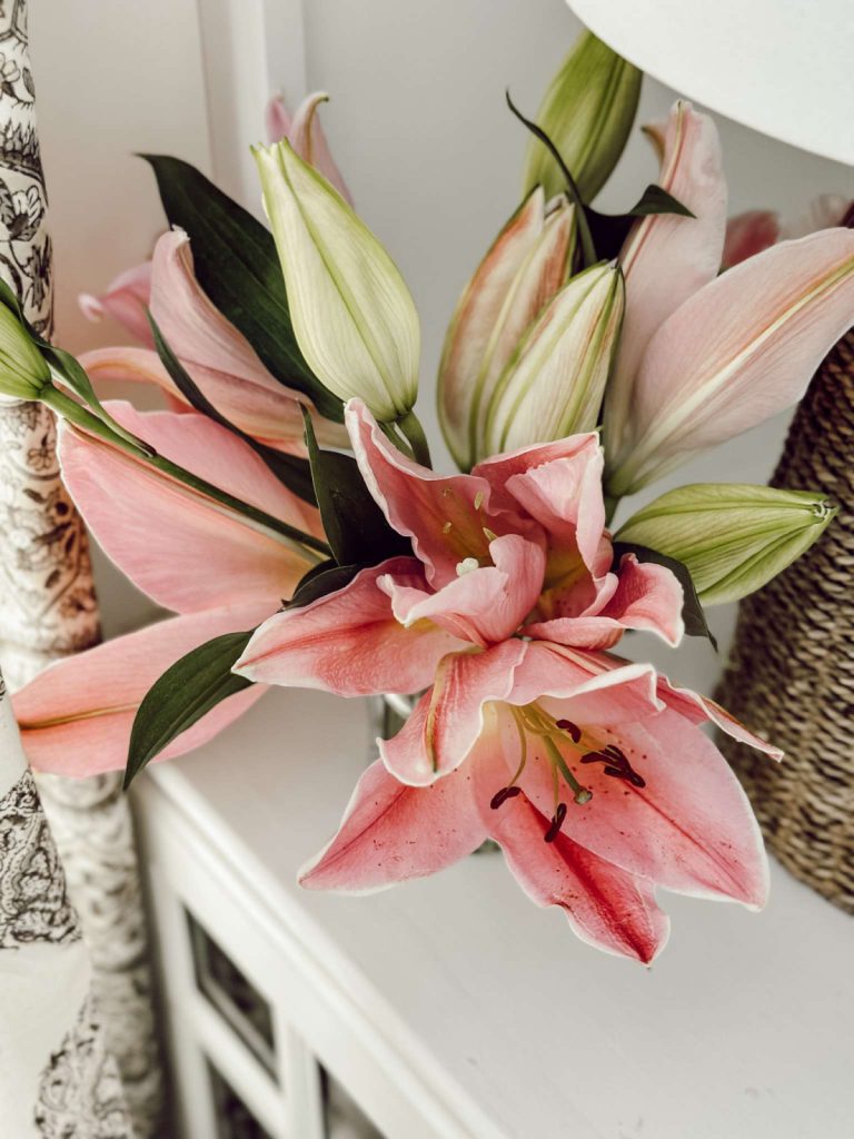 Easter lilies in farmhouse living room for Easter.