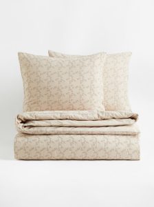 Neutral spring bedding for a cottage farmhouse bedroom.