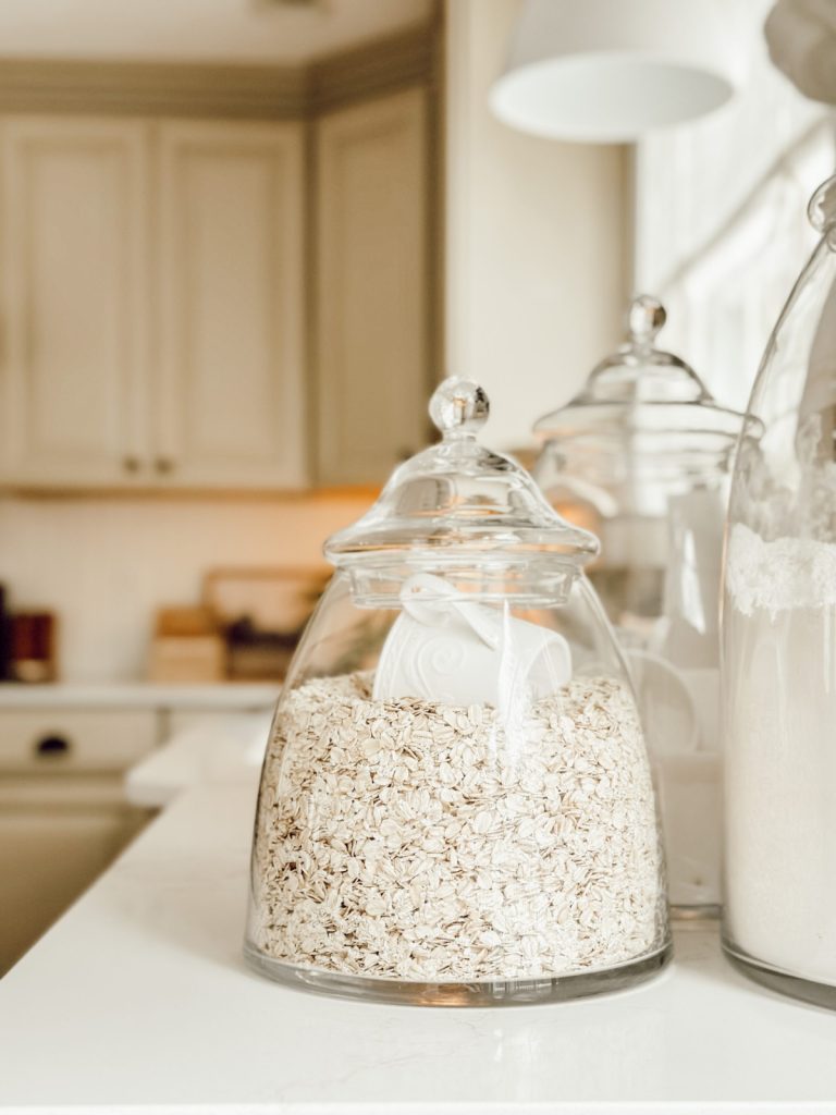 Kitchen canisters are functional decor in a cottage farmhouse kitchen.