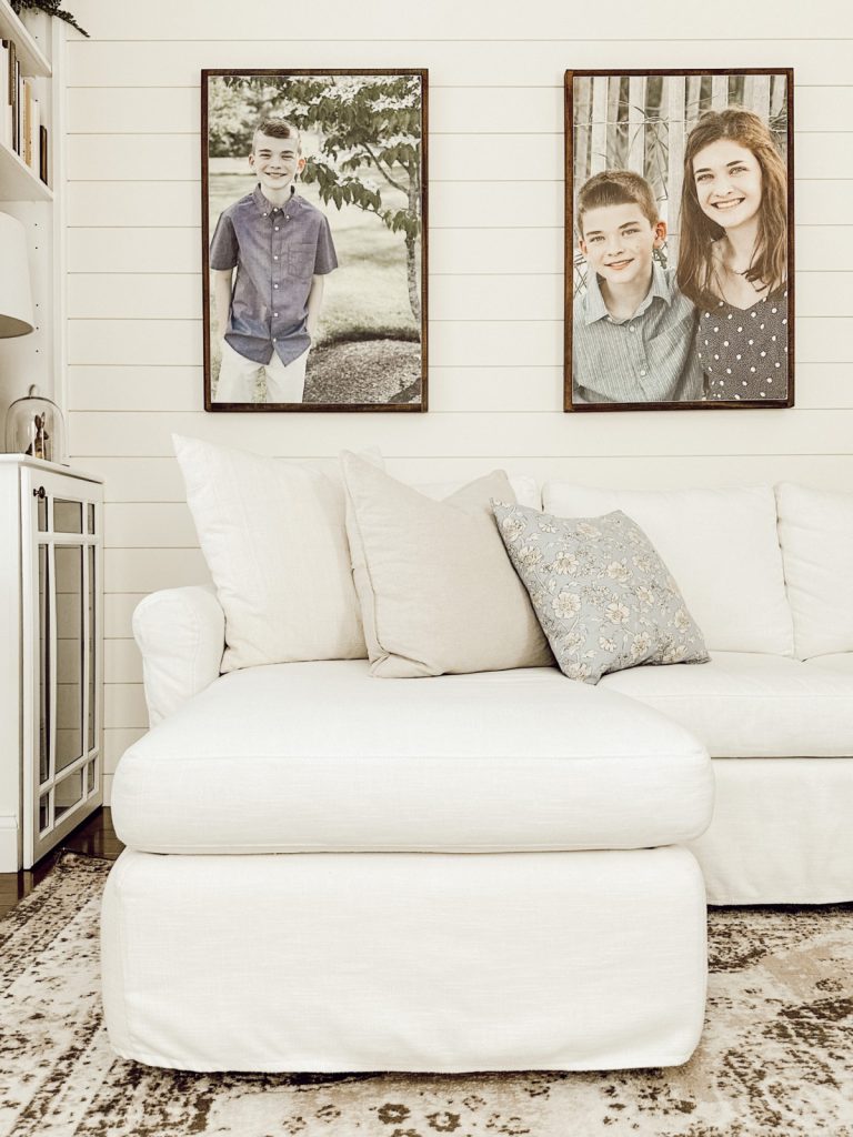 Cottage farmhouse couch with spring throw pillows.