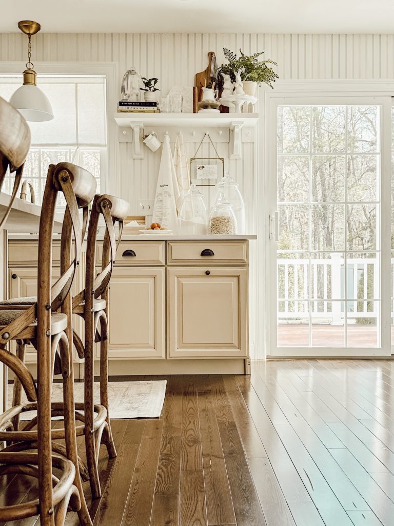 Open kitchen shelving in kitchen styled for a spring home tour.