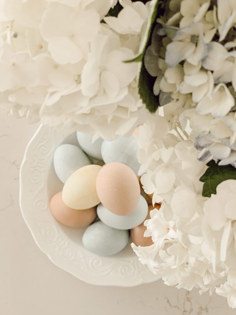 Naturally dyed Easter eggs are beautiful displayed on a kitchen counter.