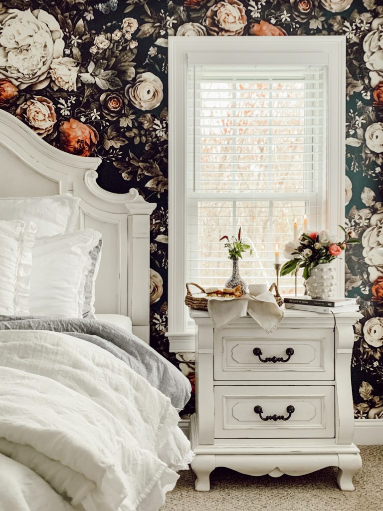 French country spring bedroom with flowers & cozy bedding.