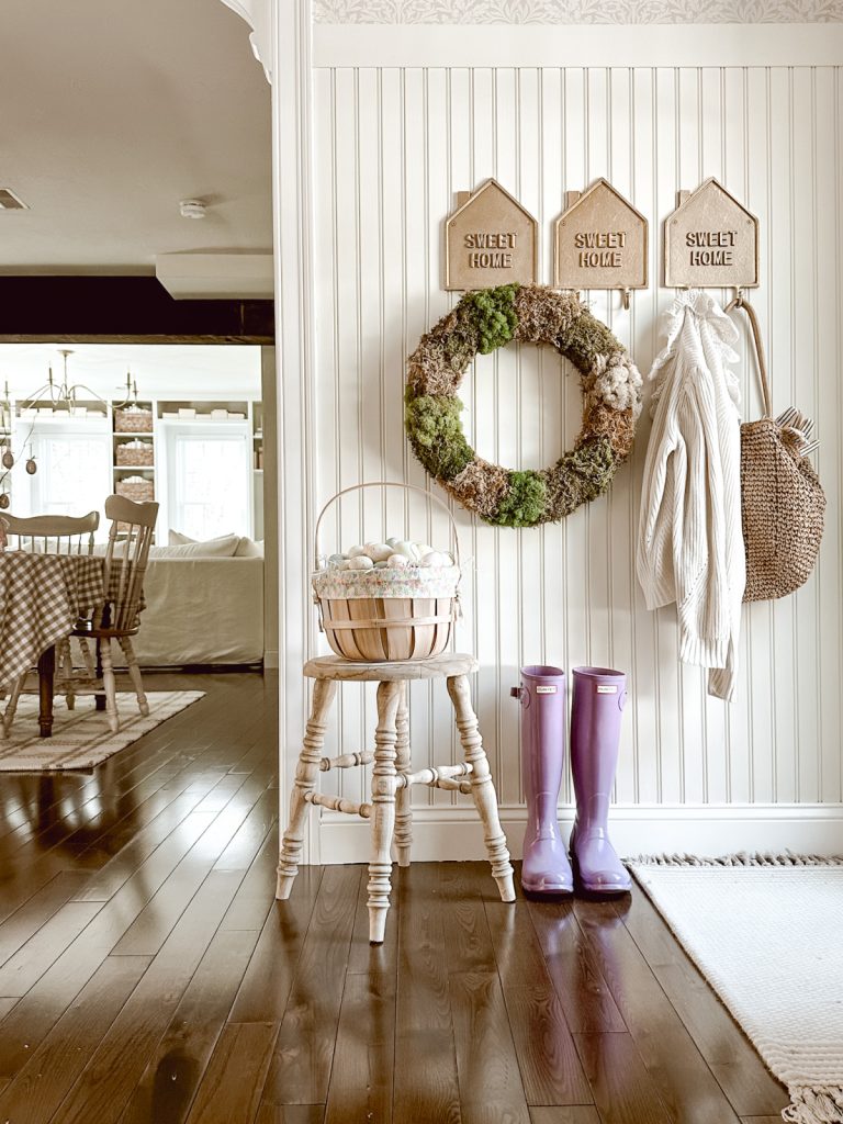 Cottage farmhouse entryway styled for Easter and spring.