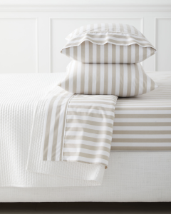 Striped cotton sheets for a cozy spring bedroom.