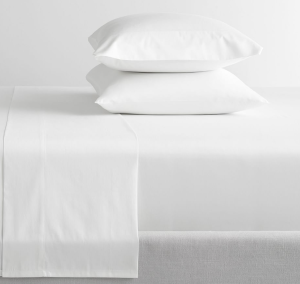 White cotton sheets will coordinate with any neutral or patterned bedding.
