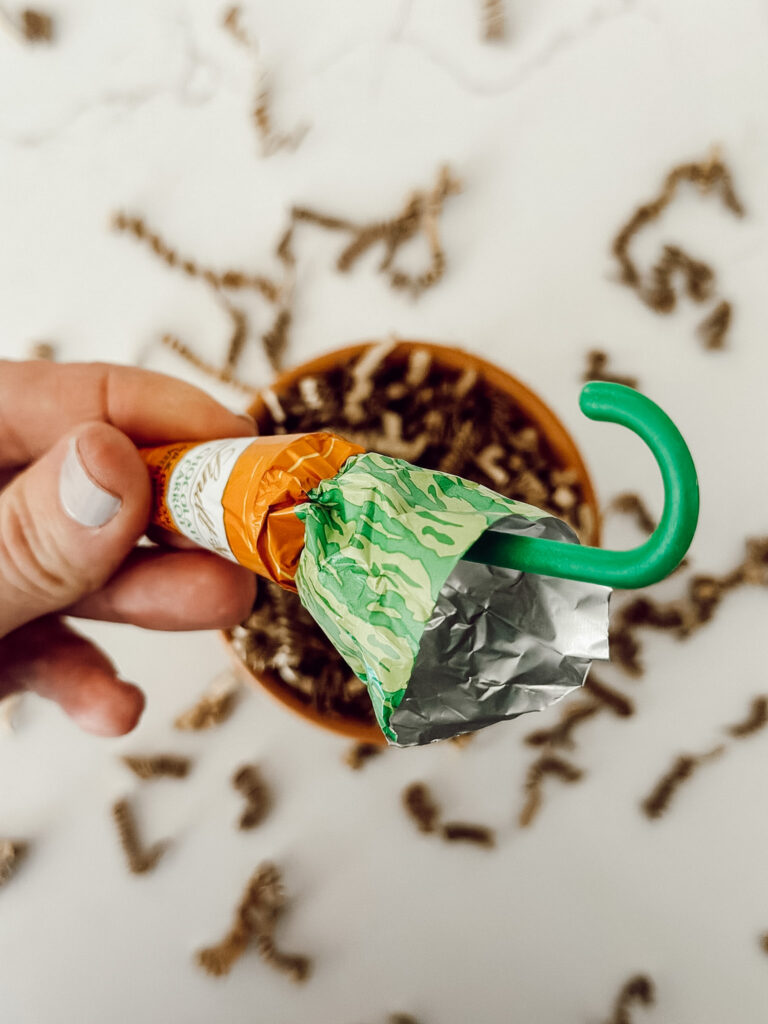 Lindt chocolate carrot will be placed into the crinkle paper inside the small terracotta pot for the DIY gift.