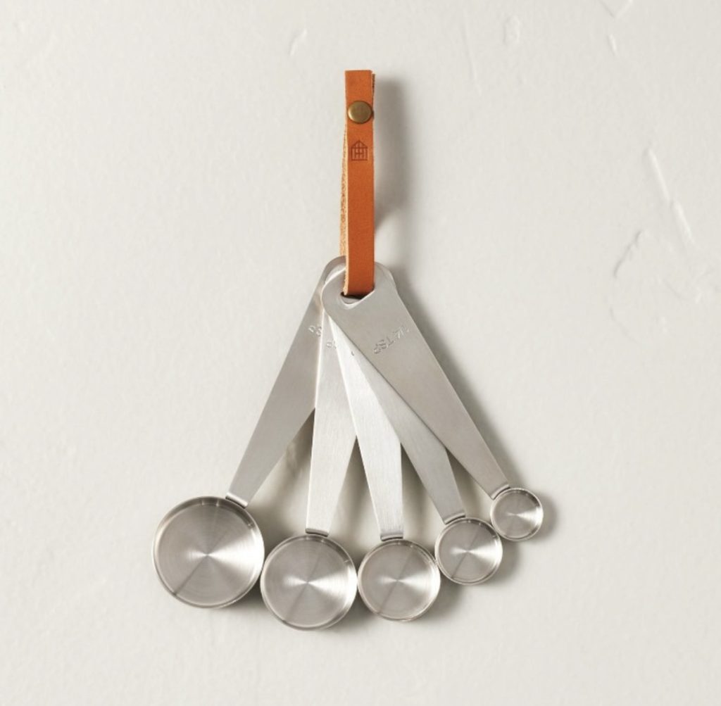 Stainless steel measuring spoons for a cottage farmhouse kitchen.