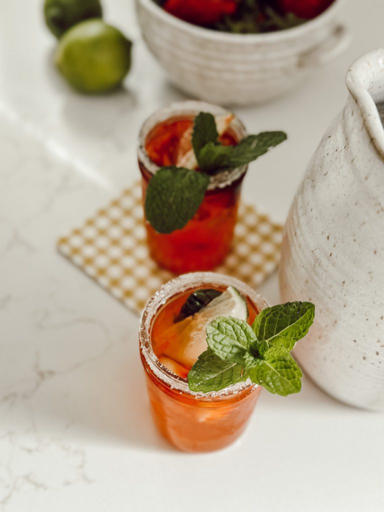 The perfect drink on a hot summer day with strawberries, limes, and mint.