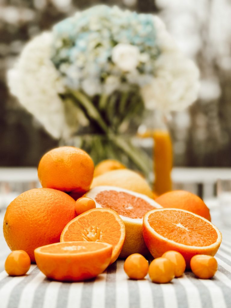 Fresh citrus fruit creates a beautiful Mother's Day tablescape.