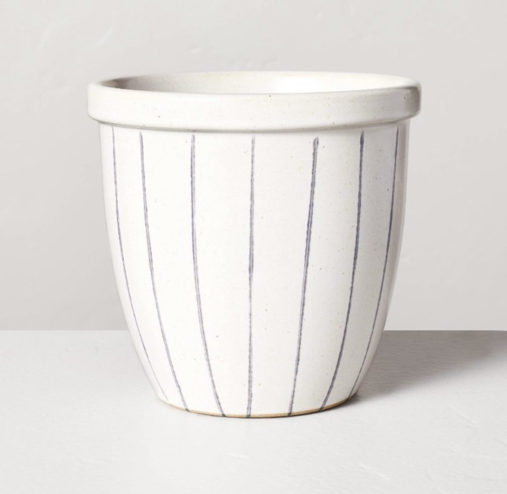White & blue striped planter for flowers, herbs, or vegetables.