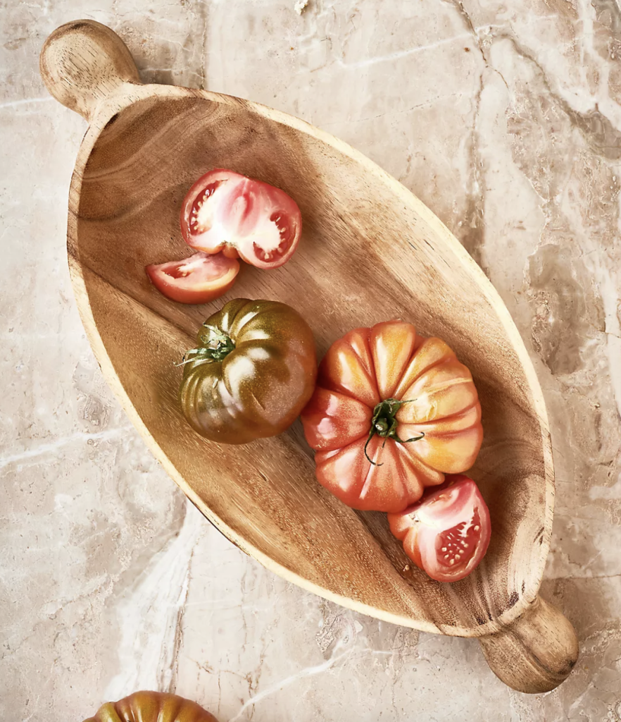 Oval serving bowl for the kitchen to hold fresh produce.