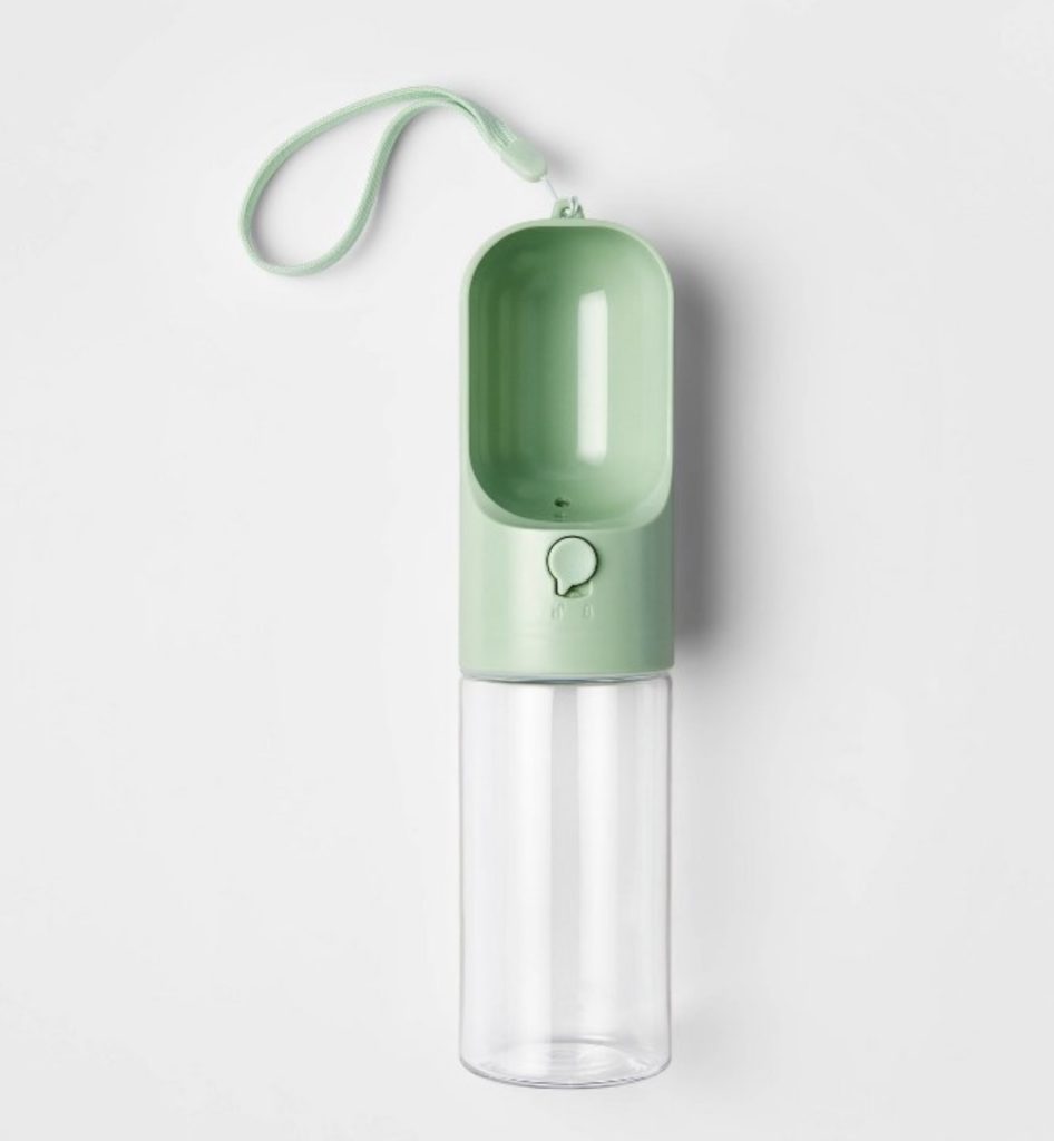 Portable water dispenser for traveling with a dog or cat.
