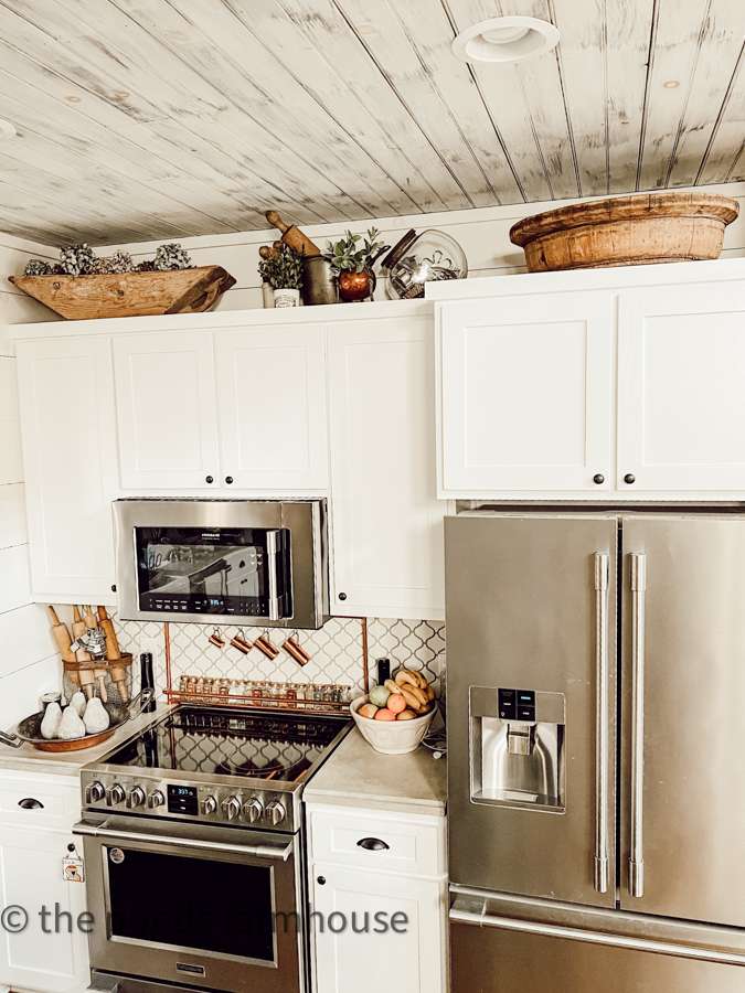 DIY Kitchen decor above farmhouse kitchen cabinets.