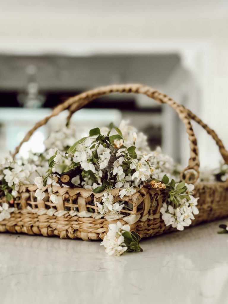 Gathering basket on the kitchen counter is a great way to decorate with baskets.