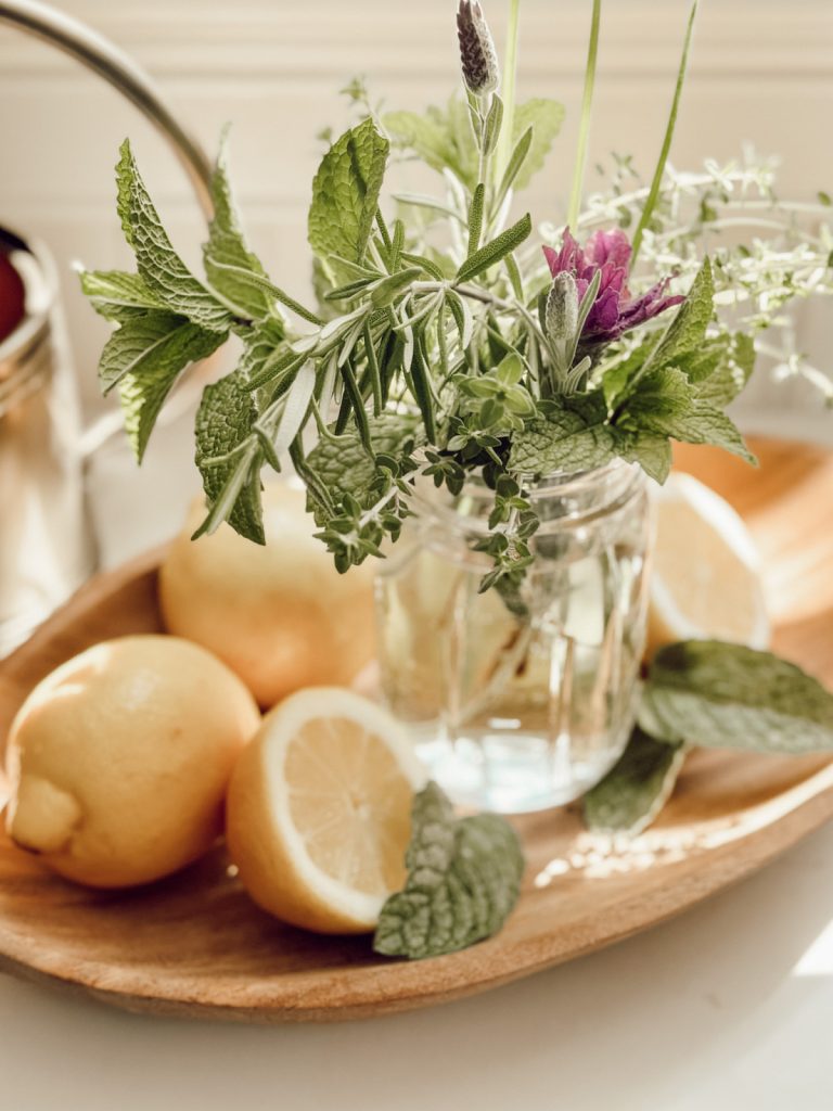 Fresh herbs & lemons in a cottage farmhouse summer kitchen.