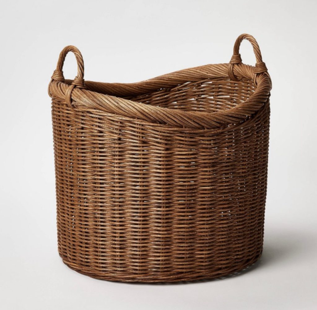 Brown basket for a farmhouse home great for storing blankets.