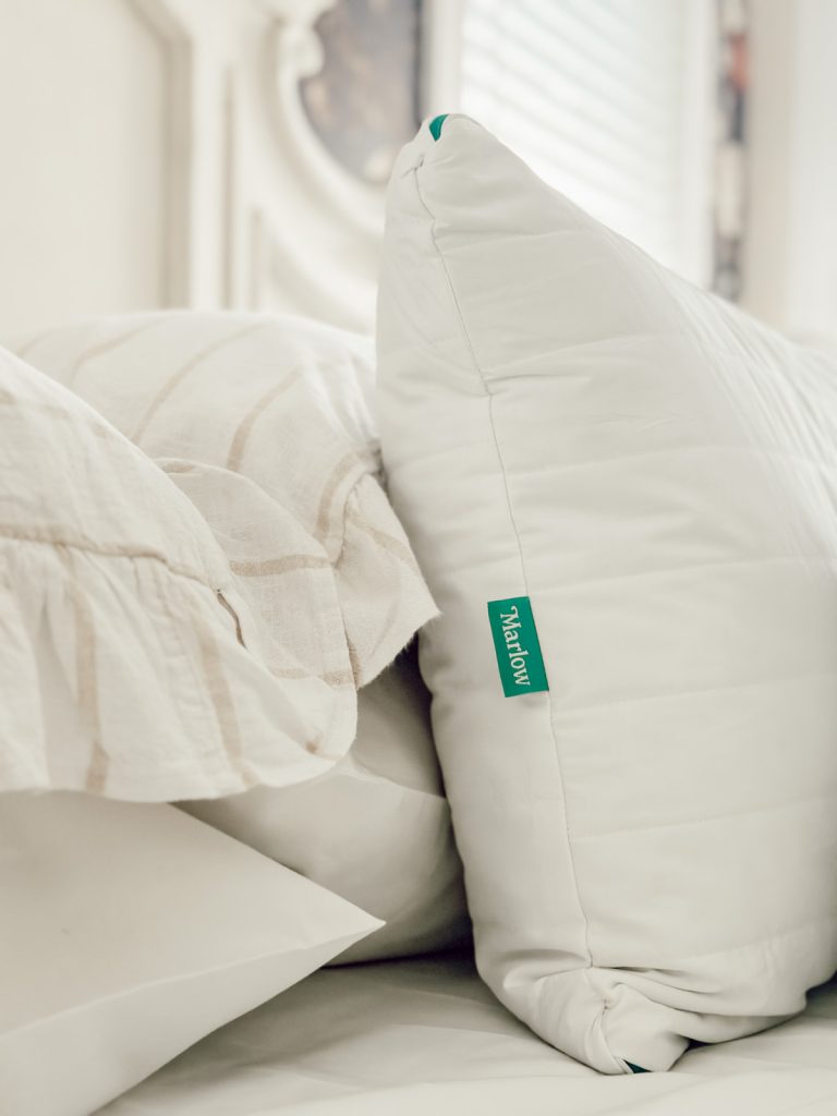 Cozy bedding is essential in a small bedroom for softness & texture.