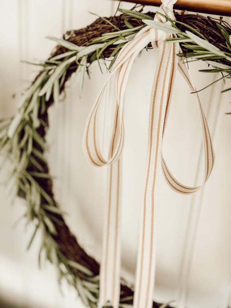 DIY rosemary wreath in the kitchen for summer home decor.
