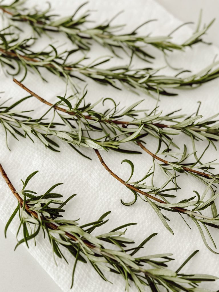 Dry rosemary on paper towel before adding to the fresh wreath.