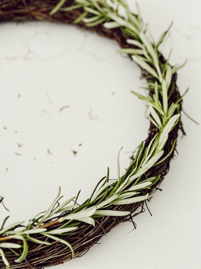 DIY rosemary wreath for rustic and charming kitchen decor.
