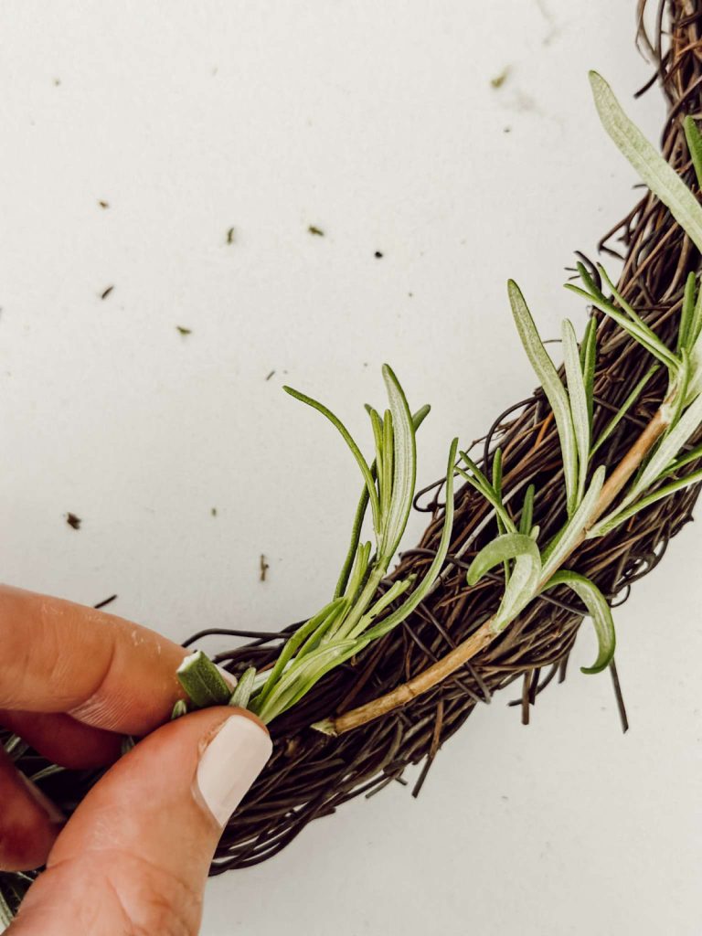 Fresh herb wreath DIY with natural elements for rustic kitchen decor.
