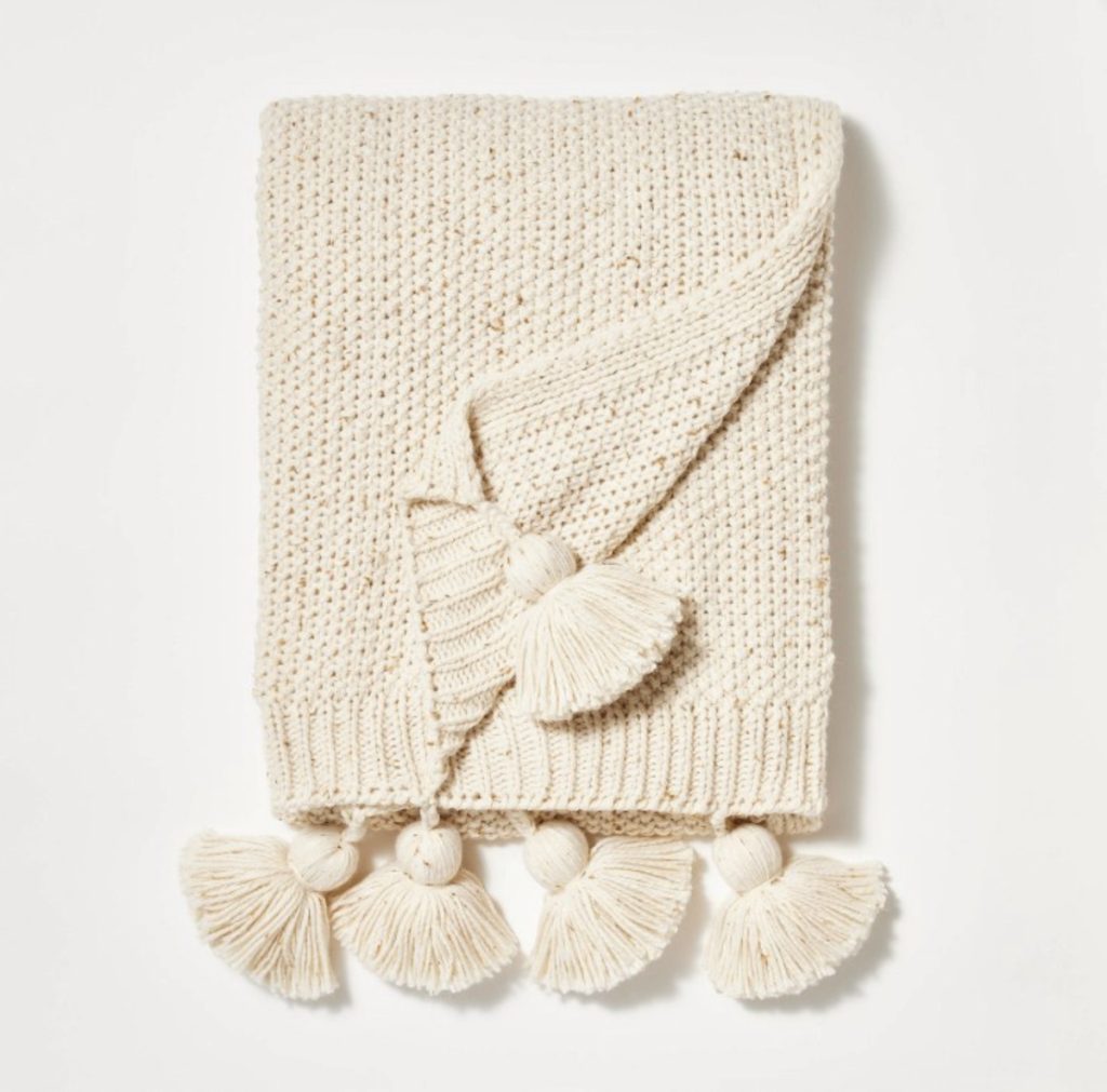 Cream knit tassel throw blanket for the couch.