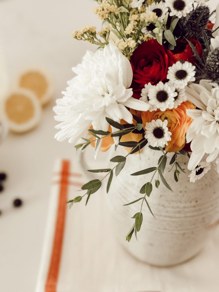 Functional kitchen decor for summer with fresh flowers & a pitcher.